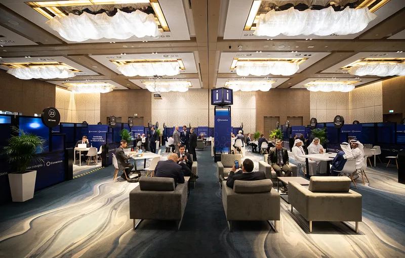 Modular Investopia meeting booths arranged as a coordinated branded discussion environment.