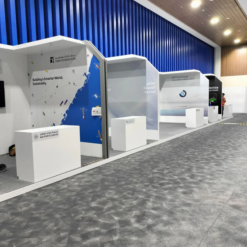 Modular three-metre-high scenic booths with painted MDF walls and integrated vinyl graphics.