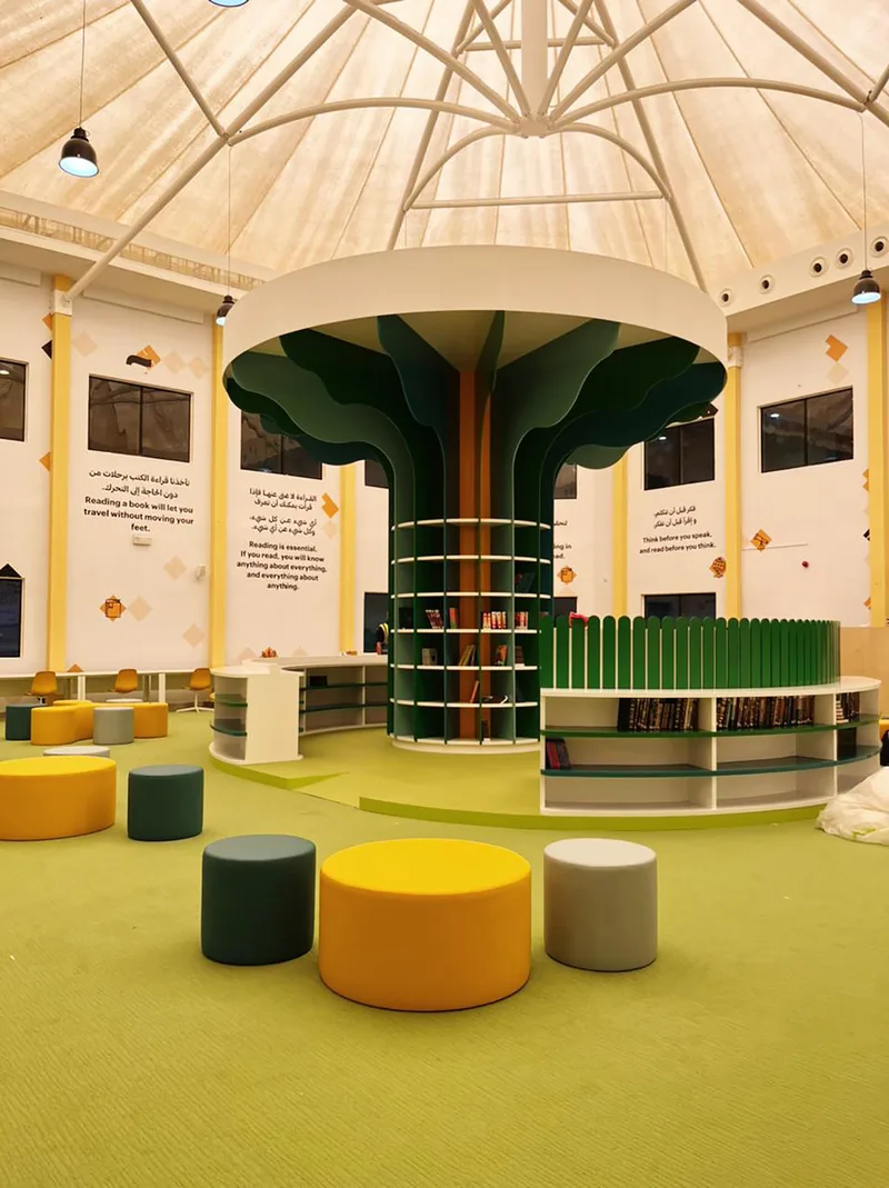 Evolution Scenic six-metre tree bookshelf with circular library seating in Abu Dhabi.