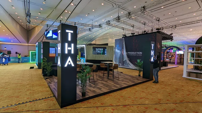 Evolution Scenic open-plan Riyadh stand with illuminated pillars and wood-effect platform flooring.