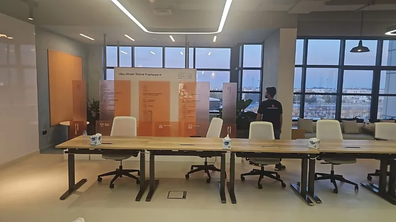 Orange-tinted acrylic display with MDF-clad boxes and branded scenic backdrop.
