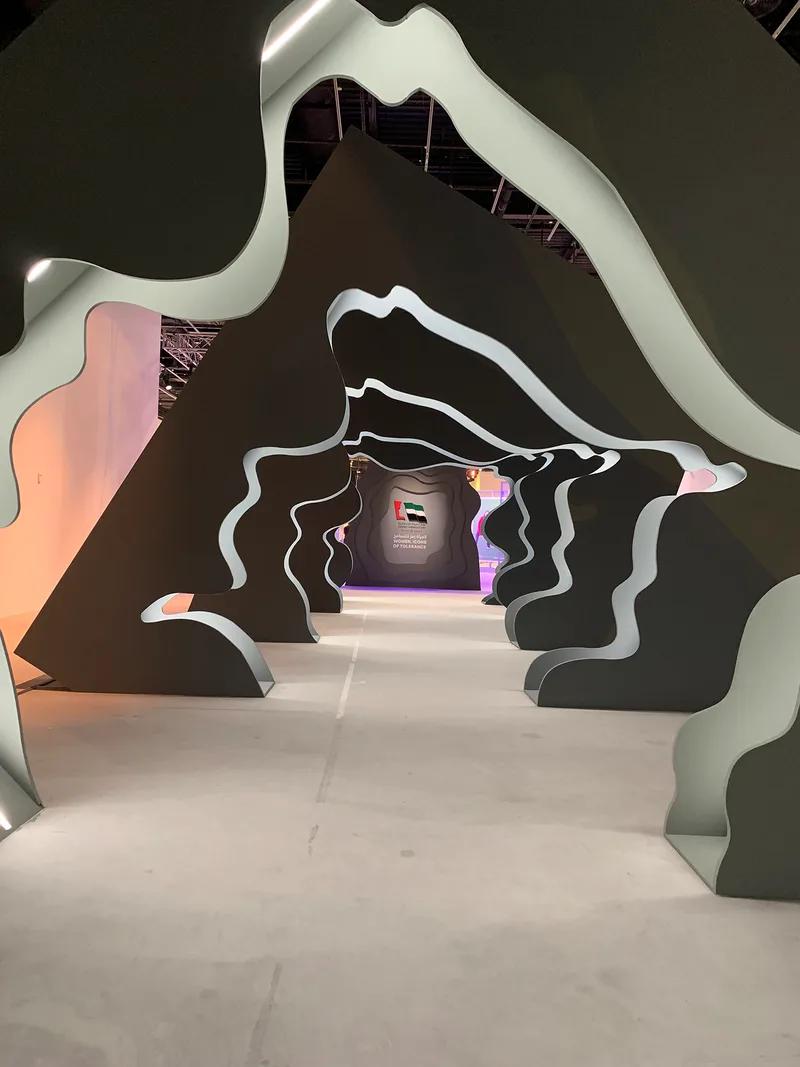 Evolution Scenic organic portal sequence forming an immersive walkway through the venue.