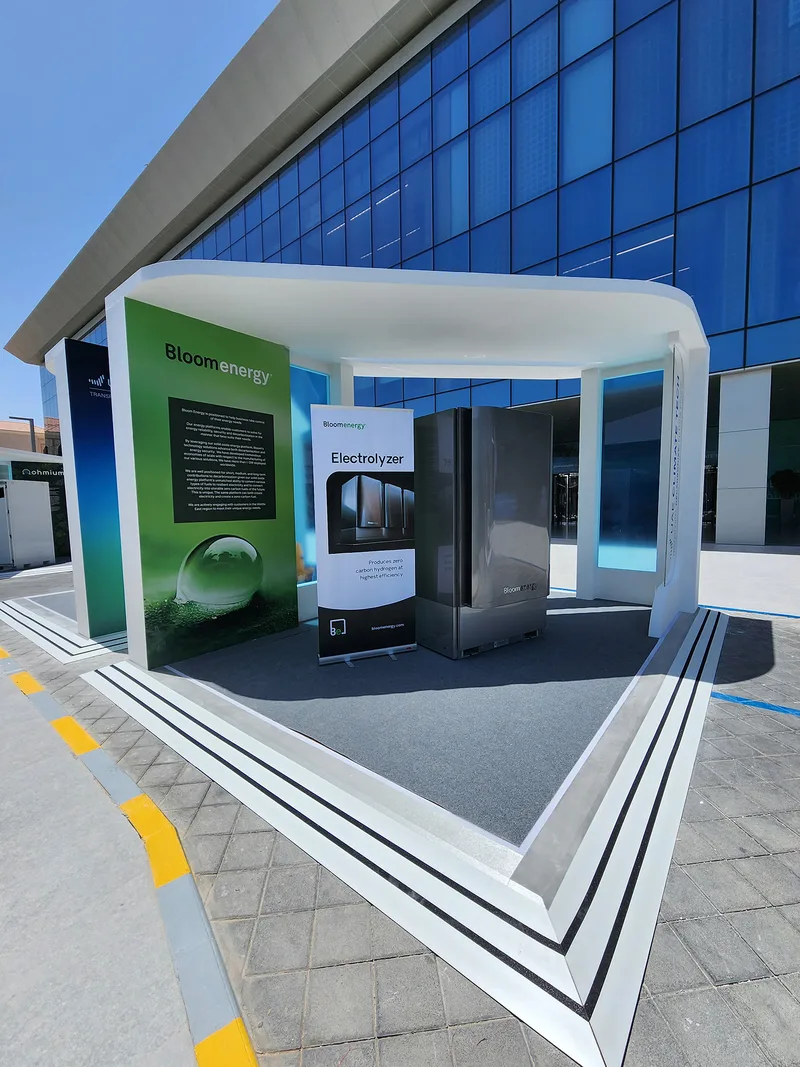 Outdoor exhibition stand with painted walling, vinyl graphics and carpet flooring.