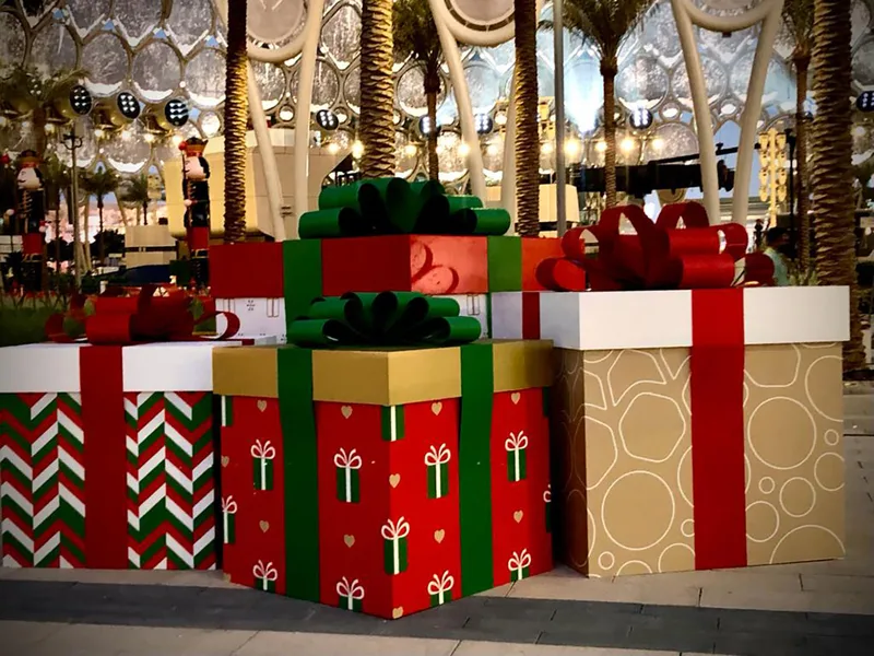 Evolution Scenic repainted oversized gift-box props with ribbons, bows and festive patterns