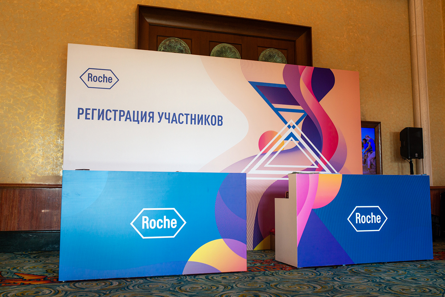 Acrylic, fabric and painted scenic finishes used across the Roche environment.