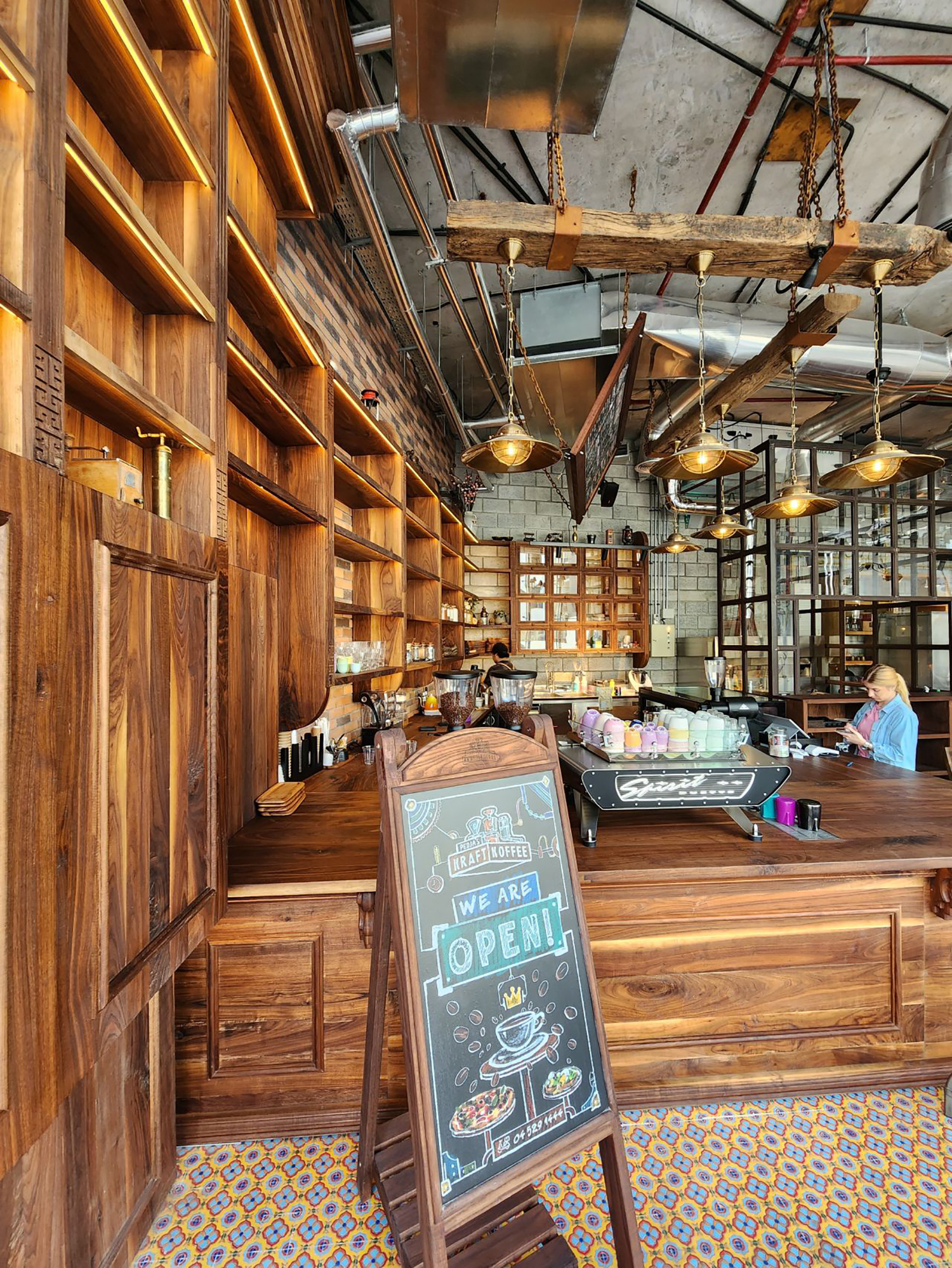 Evolution Scenic completed walnut joinery across the empty-shell coffee shop interior.

