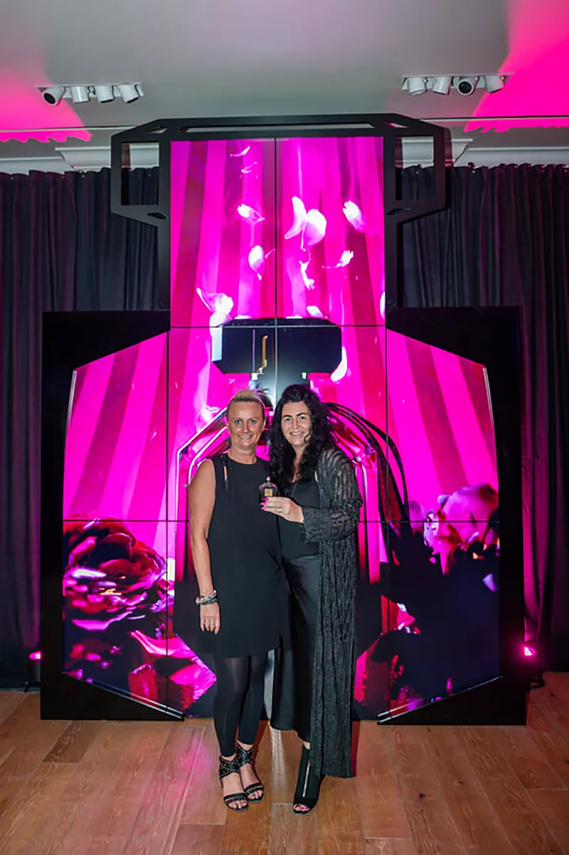Custom video wall shaped around the Victora's Secret fragrance bottle profile.