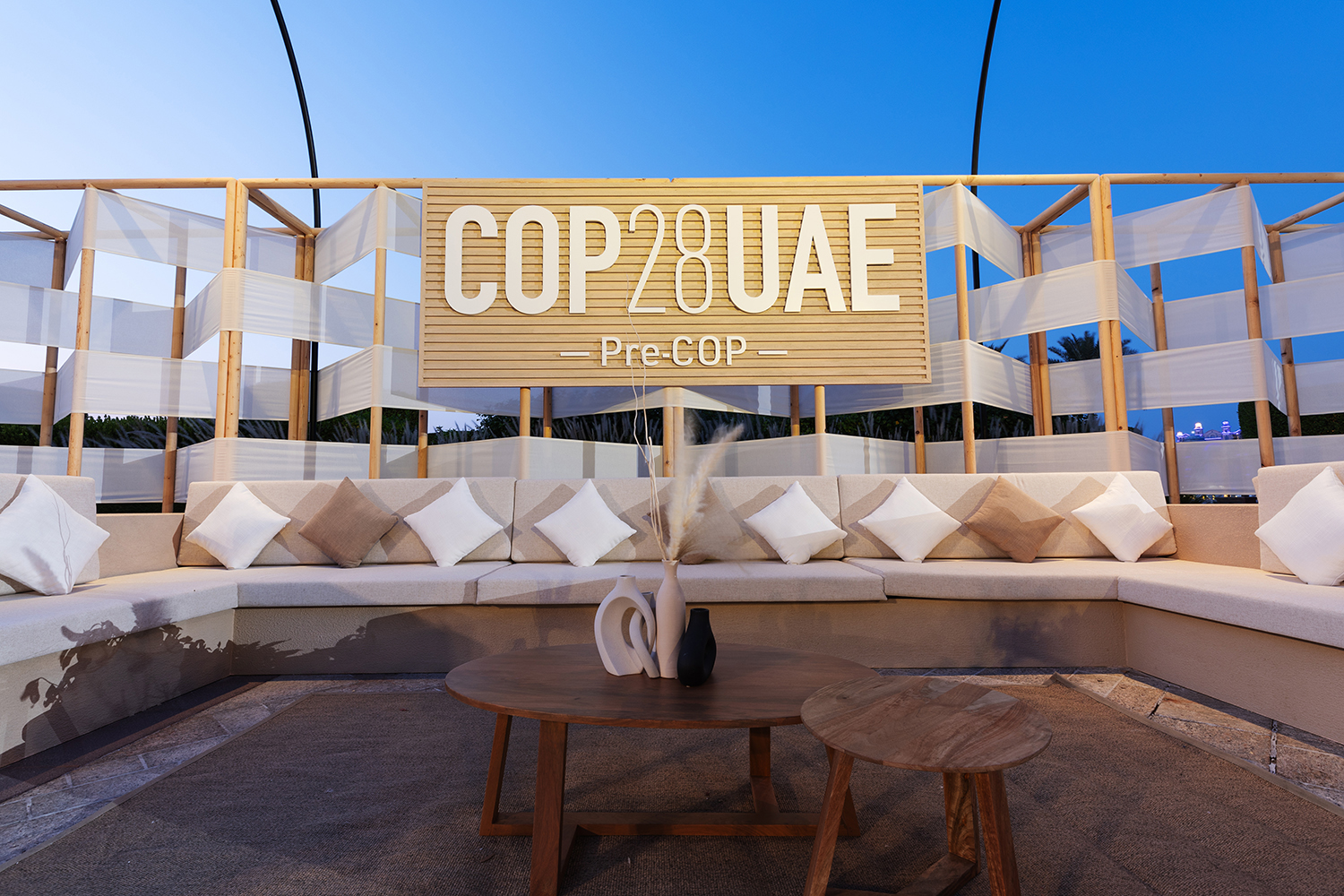 Evolution Scenic outdoor Pre-COP28 lounge with timber framing, fabric finishes and integrated branding.