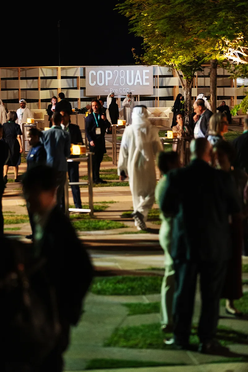 Pre-COP28 three-dimensional cut logo mounted on the timber-framed outdoor scenic backdrop.
