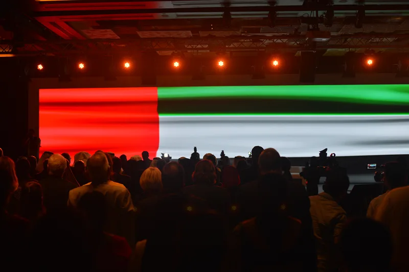 Audience viewing the large LED stage backdrop at The Principals Symposium in Dubai.