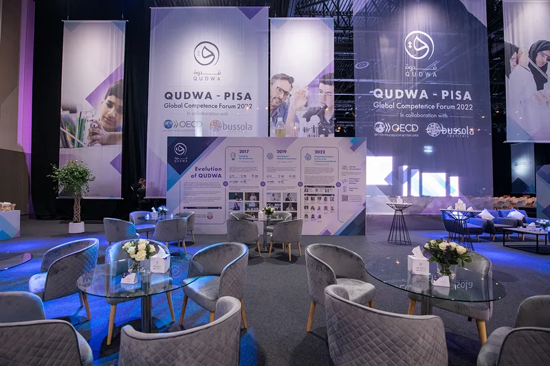 Floor-supported graphic banners positioned alongside the custom scenic environment at Expo.