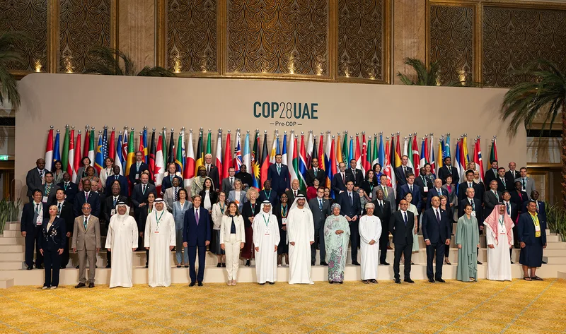 Printed fabric Pre-COP28 photo opportunity backdrop with centrally positioned conference logo.