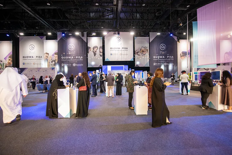 Evolution Scenic branded MDF plinths positioned throughout the Qudwa–PISA forum environment at Expo 2020 Dubai.