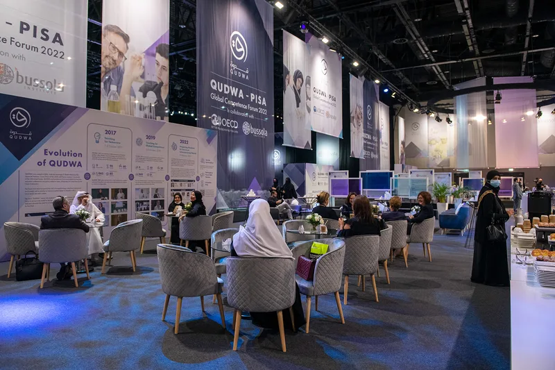 Qudwa–PISA lounge structures extending the coordinated scenic design beyond the main presentation stage.