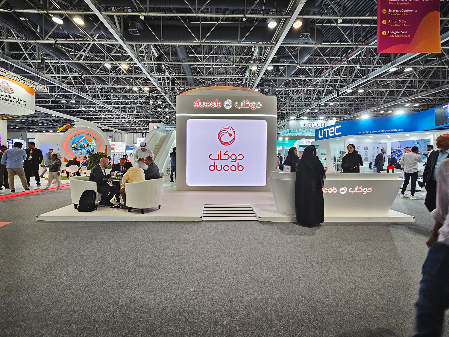 Raised exhibition platform with front access ramp and integrated DUCAB LED backdrop.