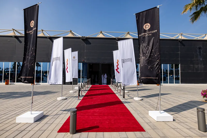 Evolution Scenic branded flag installation defining the Global Citizen Forum entrance in Ras Al Khaimah.
