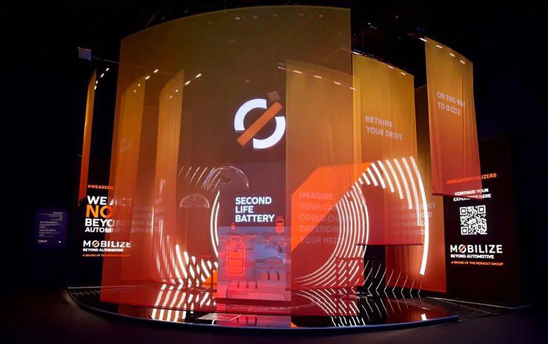 Renault stand with curved scenic platform and metal-framed fabric branding at Expo 2020 Dubai.