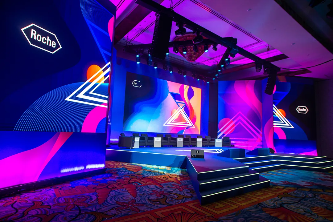 Evolution Scenic Roche conference stage with integrated LED screen surrounds in Dubai.