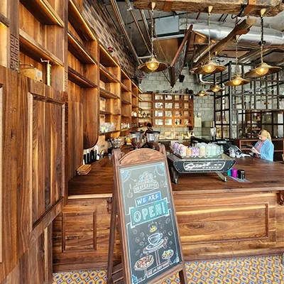rustic-coffee-shop-service-counter-open-sign.webp