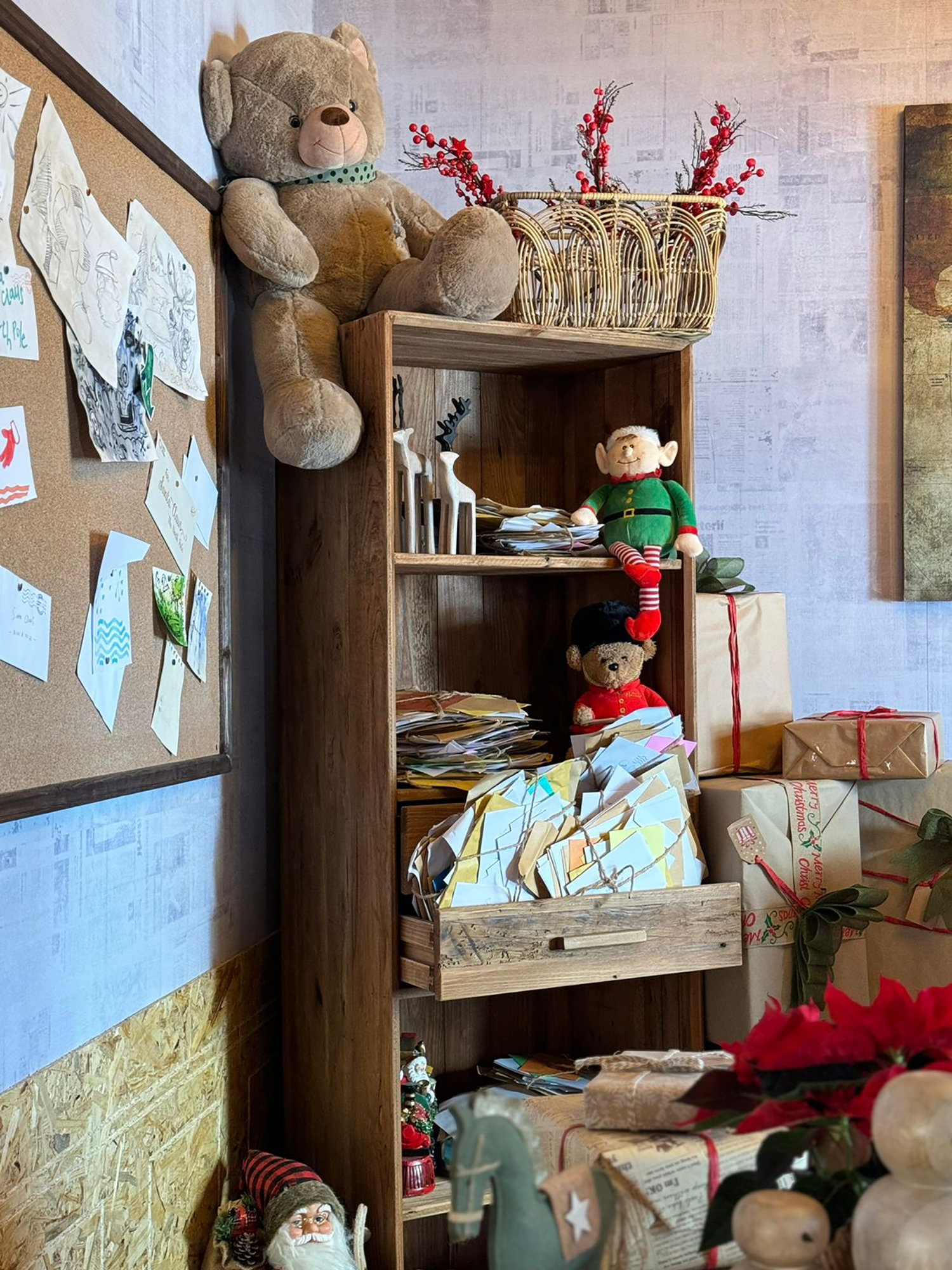 OSB-style interior panels, exposed beams and fitted storage inside Santa’s workshop.