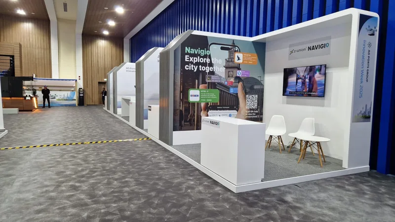 Evolution Scenic painted booth portals creating a consistent architectural rhythm across the exhibition.