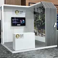 Evolution Scenic custom exhibition booth with integrated screen, branded counter and slatted portal detailing.