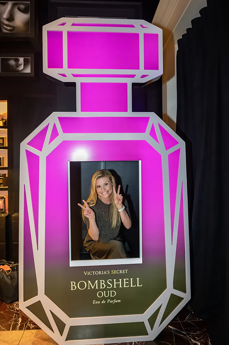 Large custom fiberglass perfume bottle forming the centerpiece of the Victoria's Secret scenic installation.