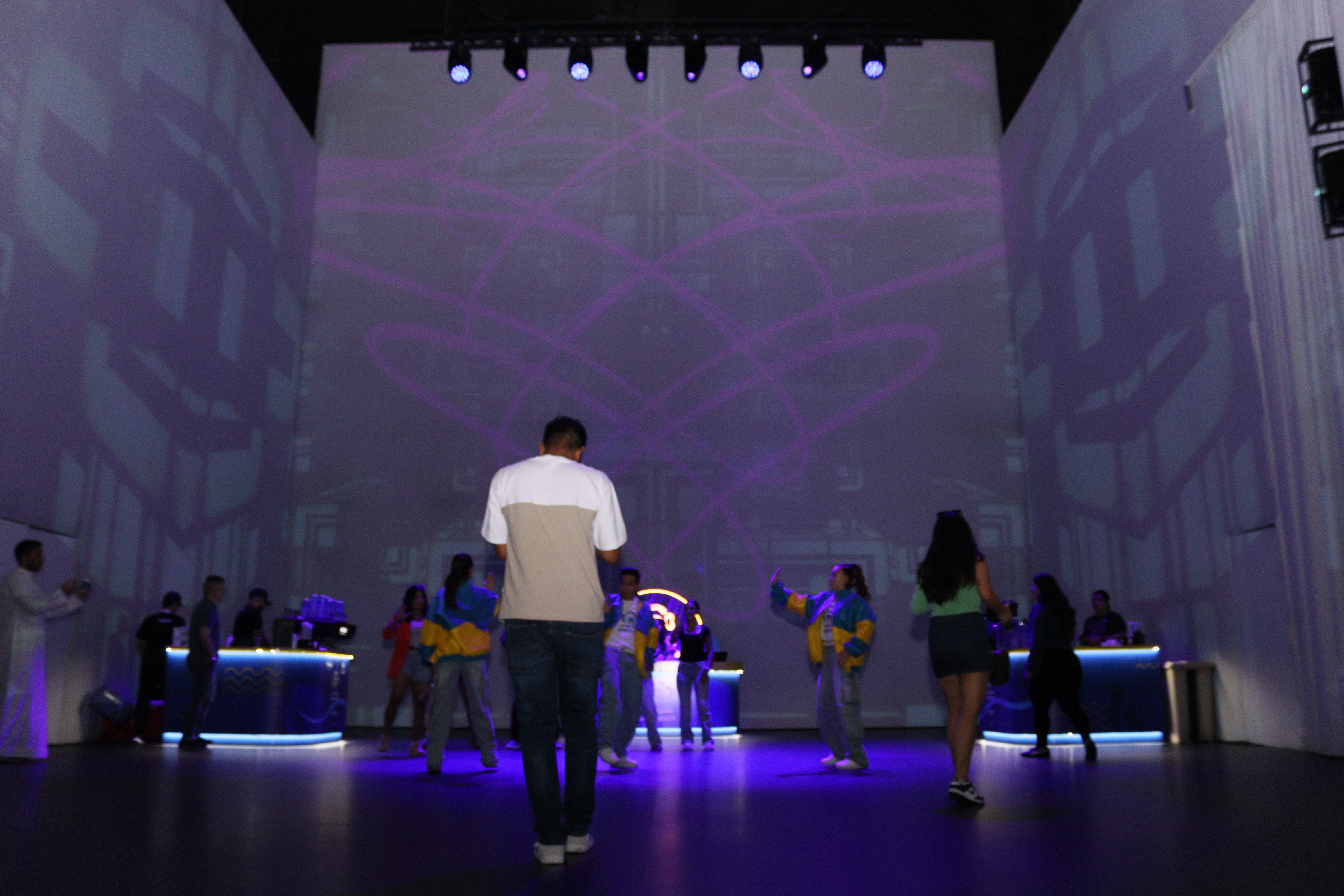 Seamless scenic projection wall finished for consistent image quality and controlled reflection
