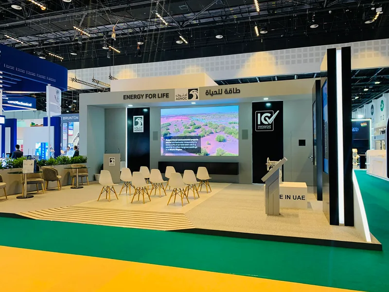 ADNOC Smart Manufacturing exhibition zone constructed with custom scenic walls and digital displays