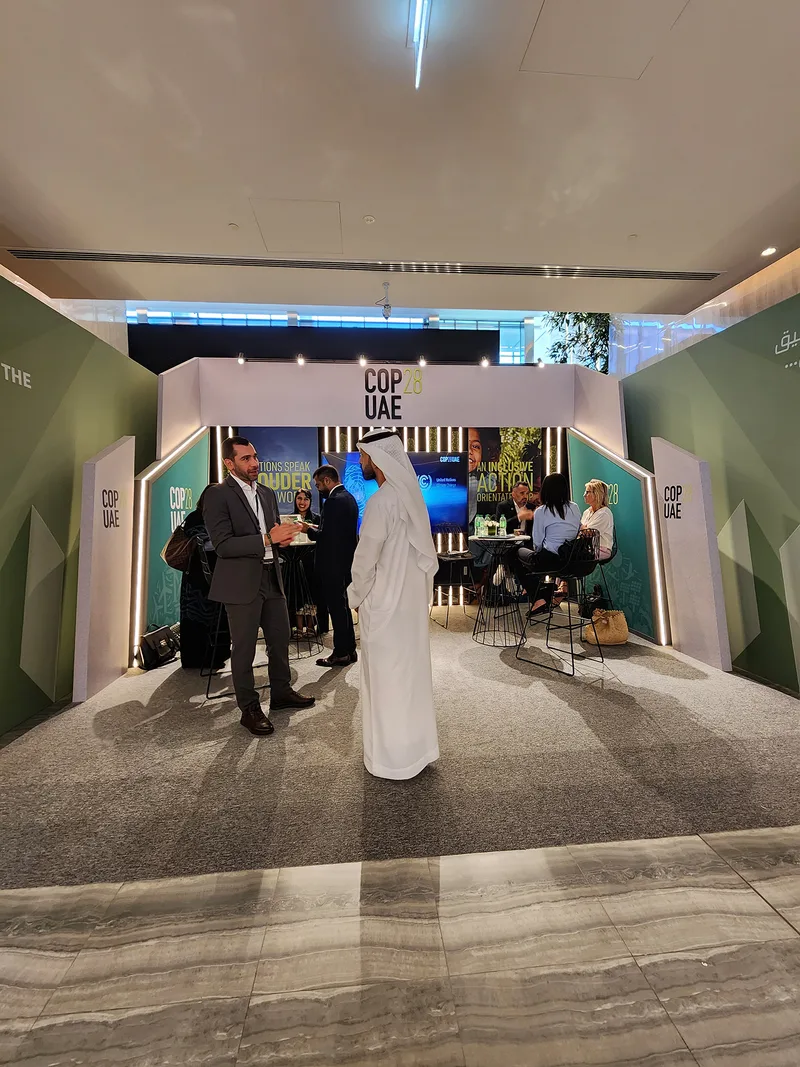 MDF scenic partitions and branded portals creating distinct zones across the Abu Dhabi venue.