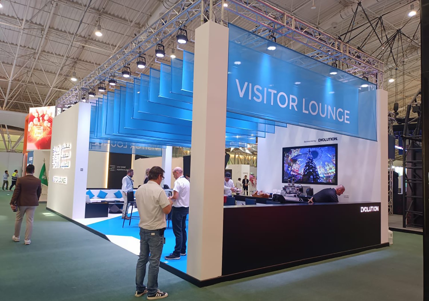 Evolution Scenic modular SES Exhibition Lounge with suspended blue fabric ceiling in Riyadh.