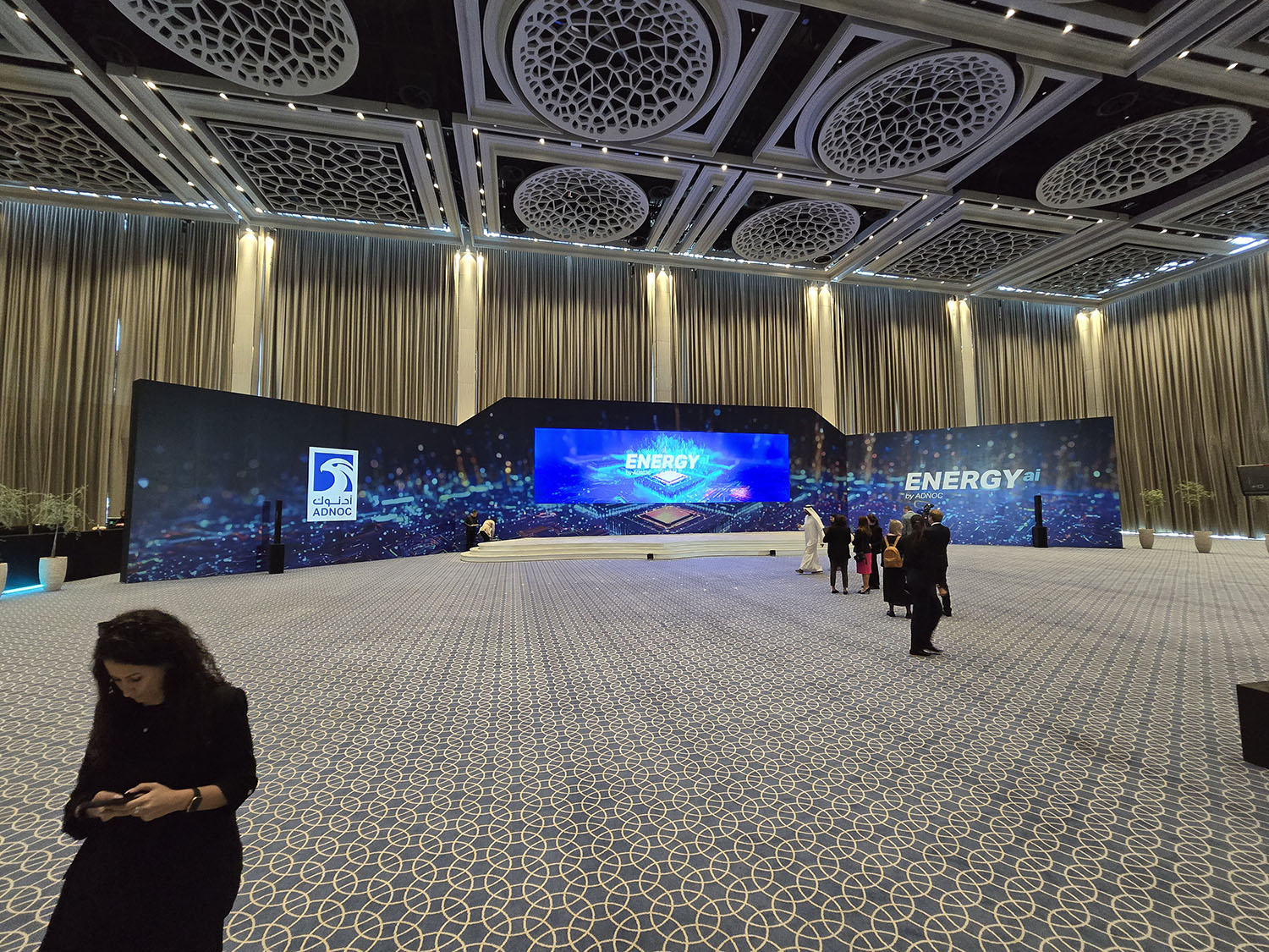 Branded timber scenic construction forming the principal backdrop at ADNOC Energy Center