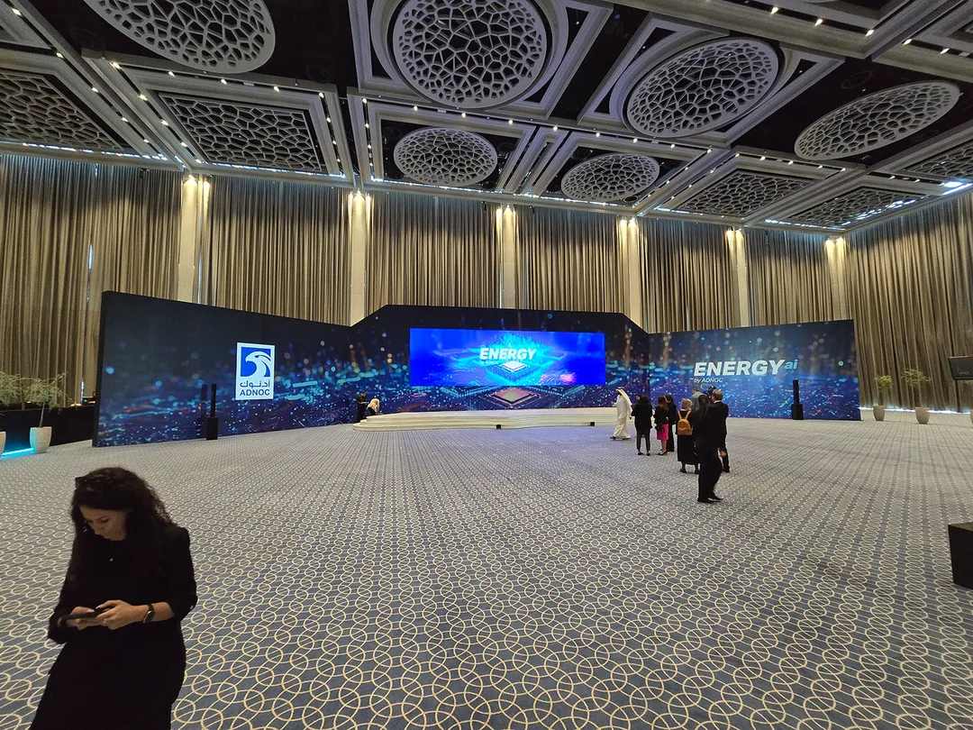 Branded timber scenic construction forming the principal backdrop at ADNOC Energy Center