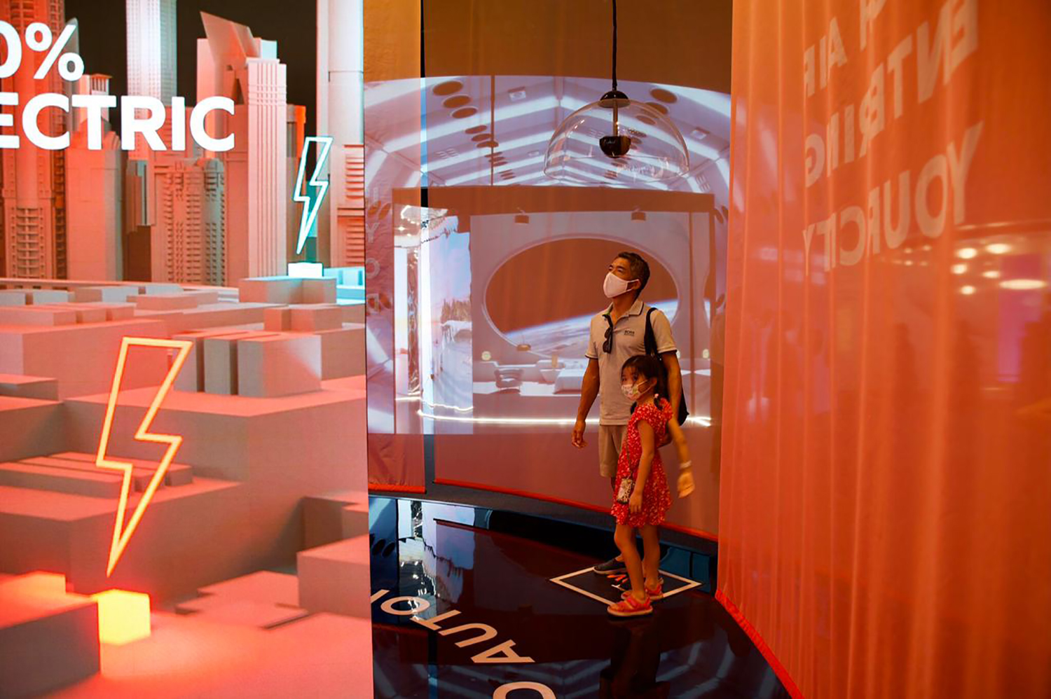 Transparent printed fabric branding suspended within the Renault stand at Expo 2020 Dubai.