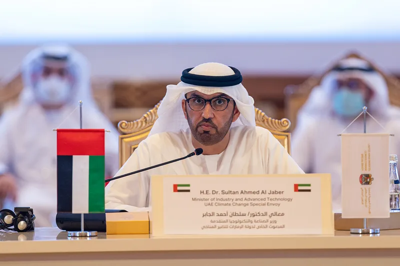 Branded delegate desk signage and UAE flag display for the UAE Regional Climate Dialogue.