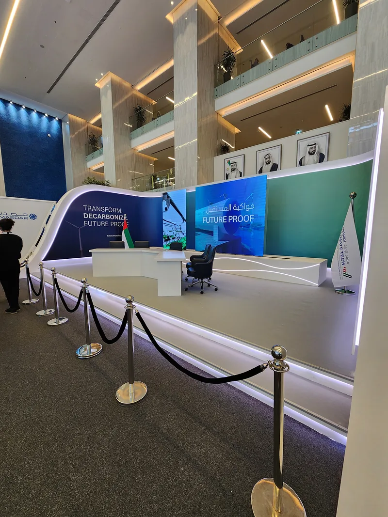 Evolution Scenic interaction stage with curved walling, integrated LED screens and illuminated stepped platform.