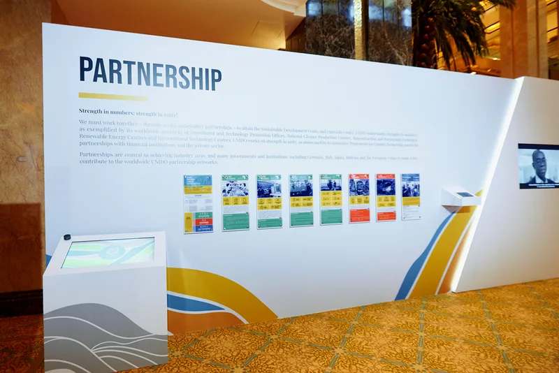 Custom exhibition structures forming the UNIDO Partnerships themed hub in Emirates Palace Abu Dhabi