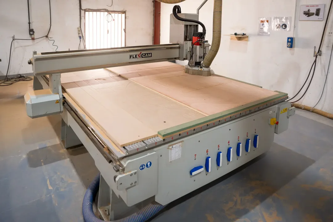 CNC cutting repeated scenic components from optimised material layouts
