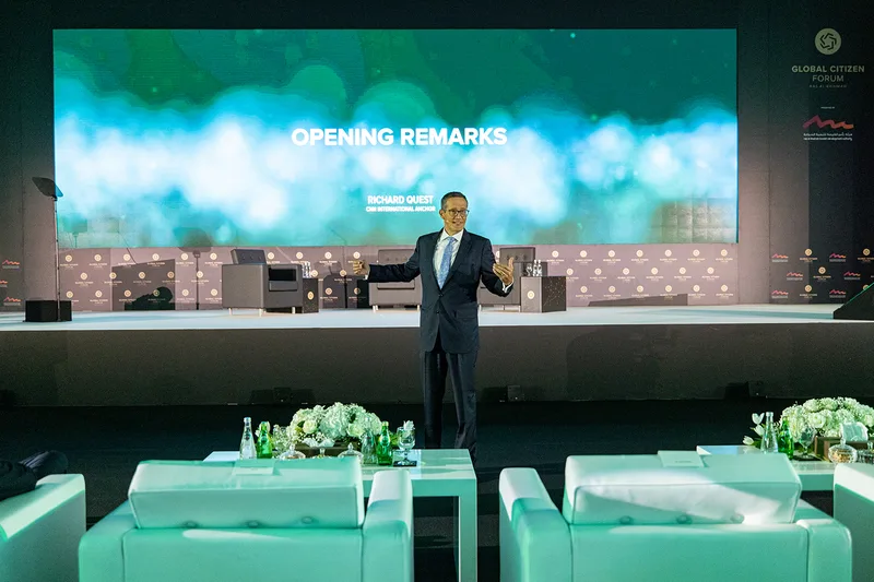 Black scenic architecture framing the venue LED display at Global Citizen Forum.