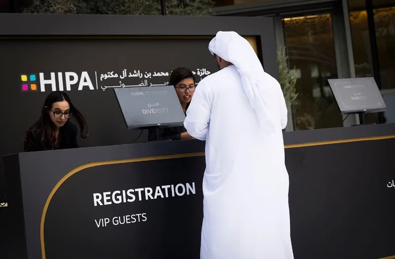 Evolution Scenic VIP registration counter with spray-painted finish and vinyl branding