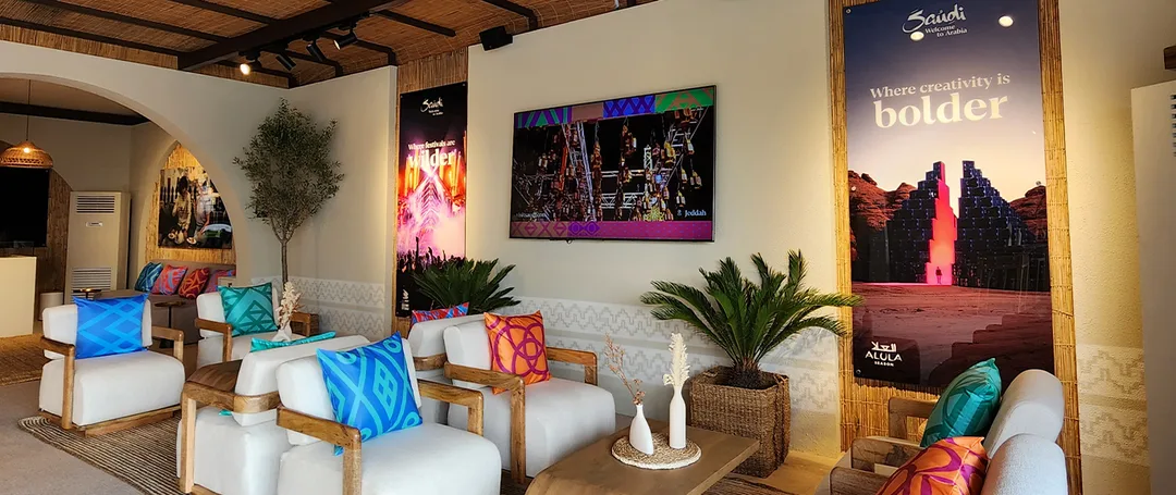 Evolution Scenic Visit Saudi hospitality tent with custom barasti ceiling and branded scenic walls.