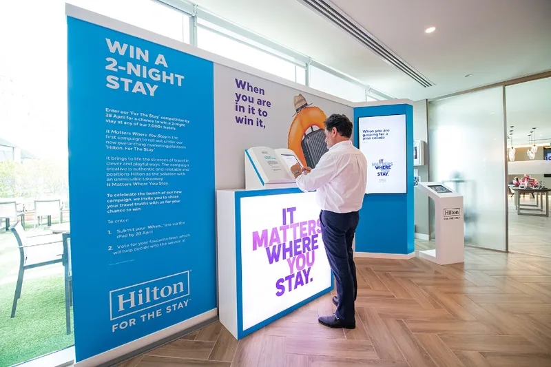 Touchscreen engagement kiosk within hospitality activation