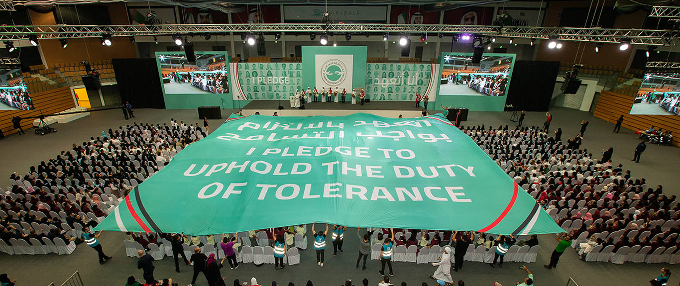 Evolution Scenic integrated stage and branded backdrop for the Youth Tolerance Rally in Abu Dhabi.